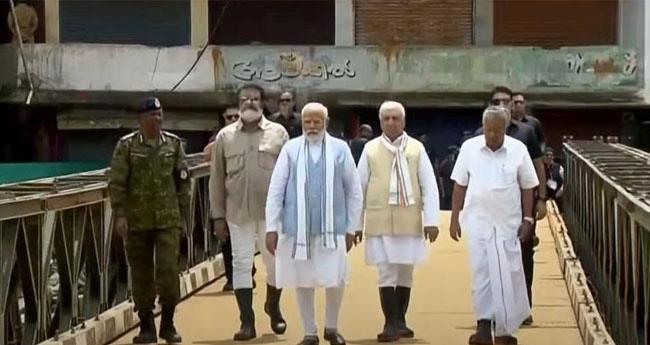 ദു​ര​ന്ത​ത്തി​ന്‍റെ ഭീ​ക​ര​ത നേ​രിൽ കണ്ട് മോ​ദി; സാഹചര്യം വി​ശ​ദീ​ക​രി​ച്ച് മു​ഖ്യ​മ​ന്ത്രി